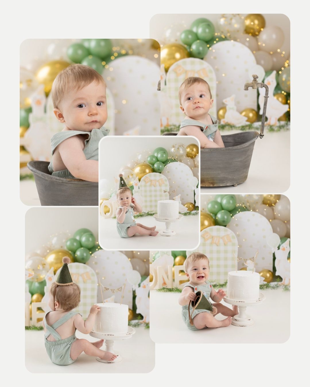 A baby in a gray romper sits among green and gold balloon decorations with white floral arrangements in a dreamy party setting. Elizabeth