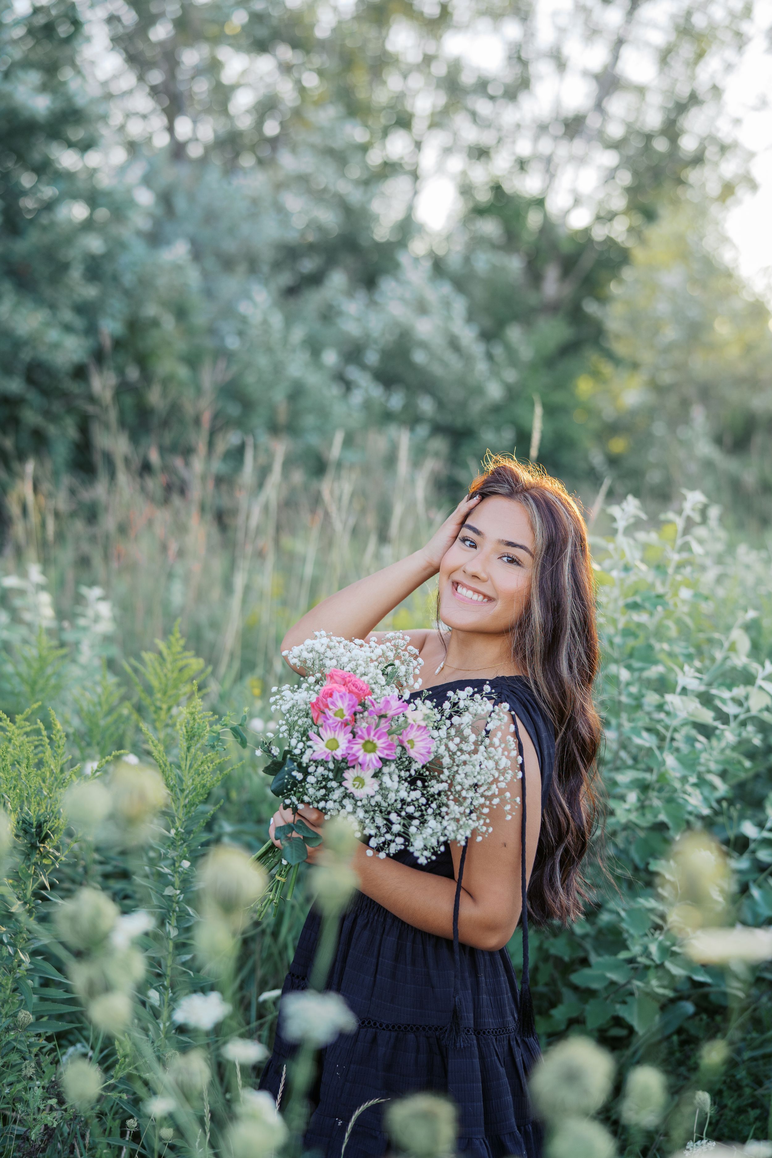 A dreamy outdoor photoshoot in a wildflower field featuring delicate baby's breath bouquets and natural lighting.