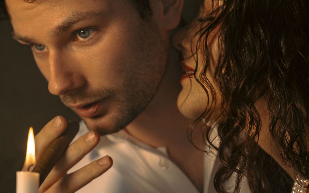 A series of intimate portrait shots in warm lighting showing someone smoking a cigarette.