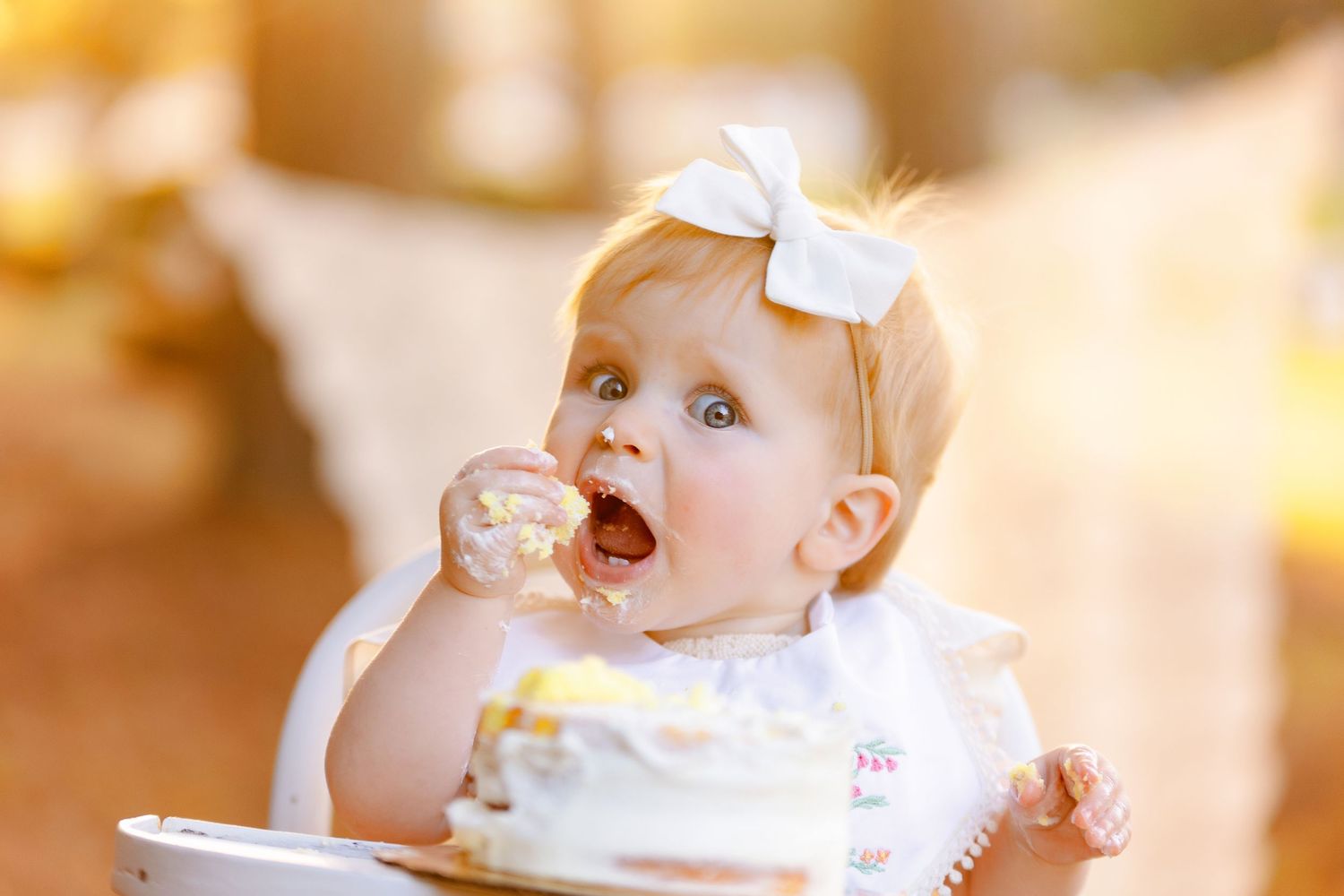 Girl feeding herself cake. Greenville sc newborn photographer, Easley sc newborn photographer, Upstate sc newborn photographer