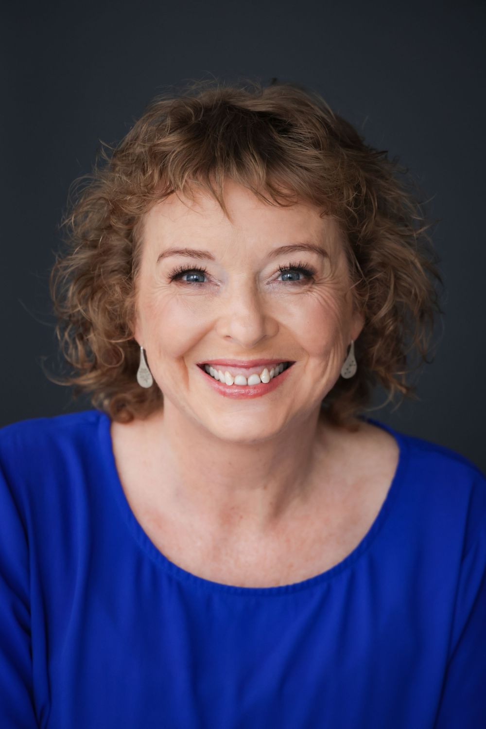Jody Bews-Hair in an engaging headshot/portrait taken in the studio in Grey Lynn Auckland by photographer, actress,  artist Amanda Billing.