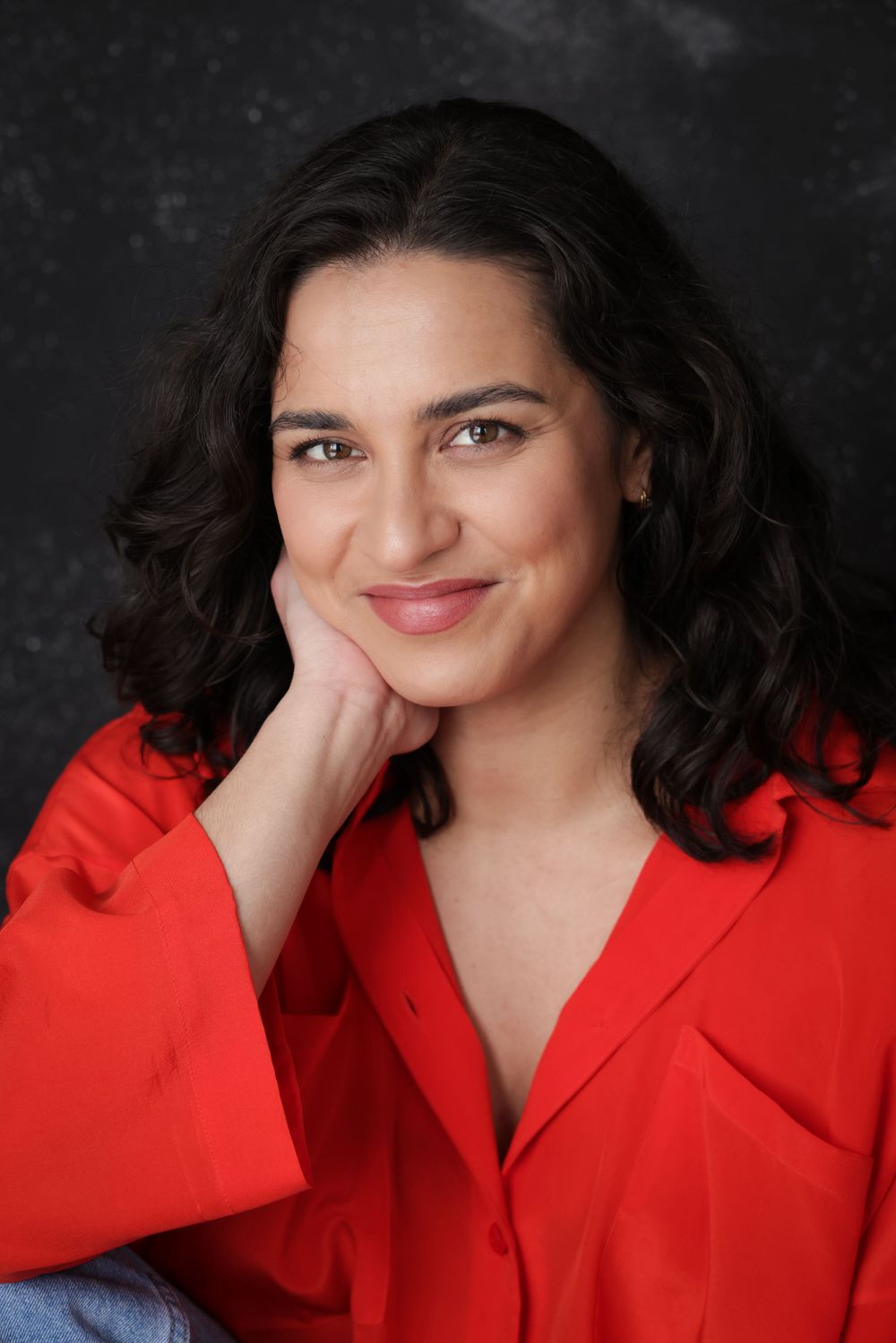 Tessa Rao in an engaging actor headshot/portrait taken in the studio in Grey Lynn Auckland by photographer, actress, artist Amanda Billing.