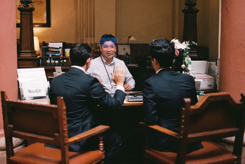 Two grooms perform the legal requirements to be civilly married, captured by a Santa Barbara wedding photographer.