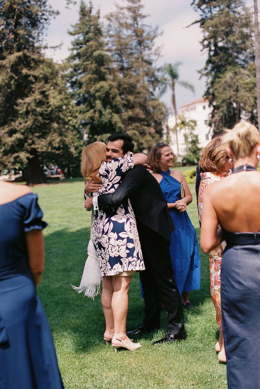 A groom hugs his mother captured on 35mm film following his civil wedding ceremony at the Santa Barbara Courthouse