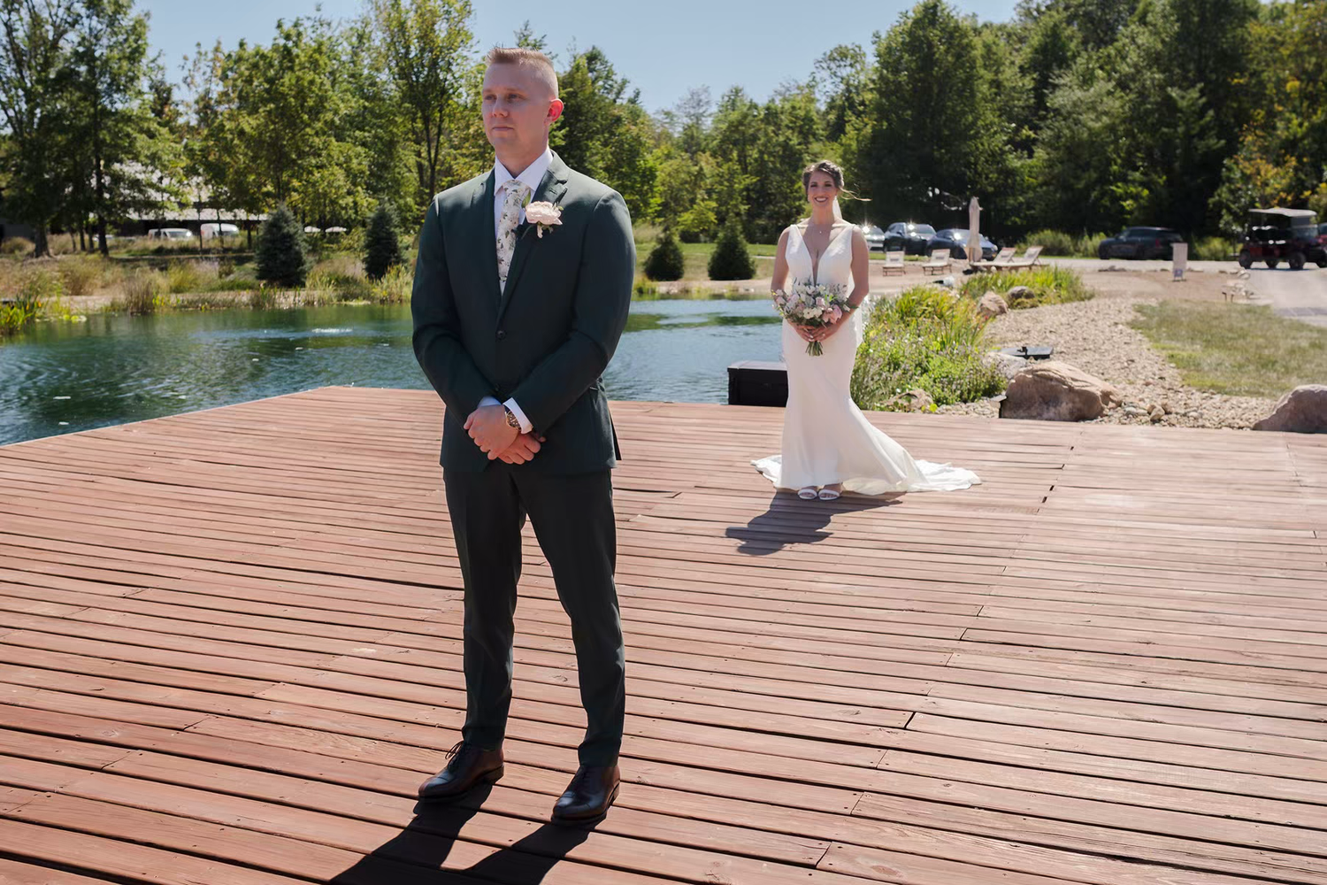 A couple doing first look  on a wooden deck at Retreat 21 Wedding Venue