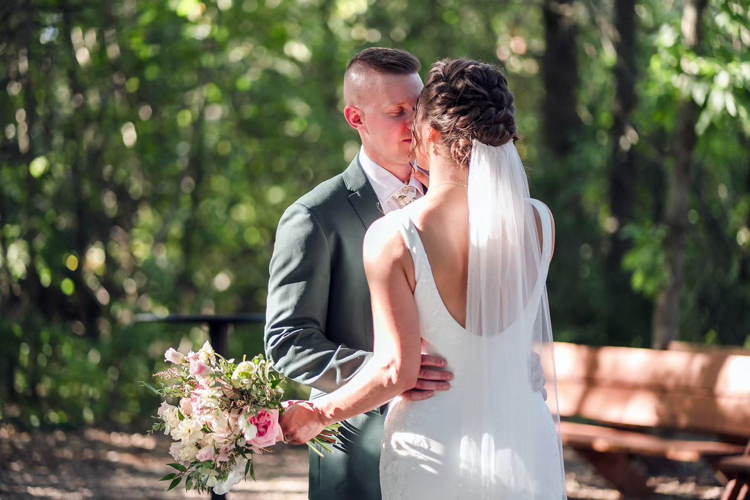 A romantic outdoor wedding moment captured by sassi photo at Retreat 21 Wedding Venue