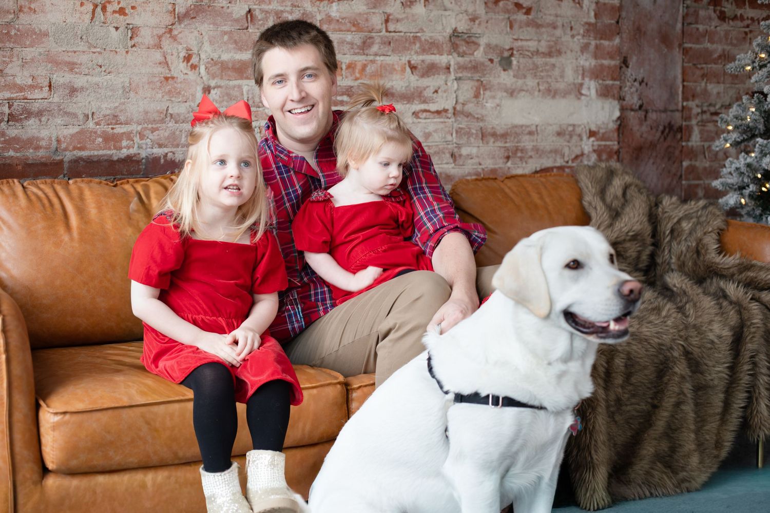 Cincinnati Christmas photography featuring dad with kids and dog holiday portraits capturing playful, candid seasonal family moments