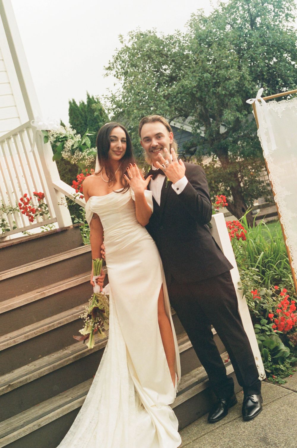 A series of wedding photos showing a couple dancing on an outdoor porch decorated with red flowers and white columns.