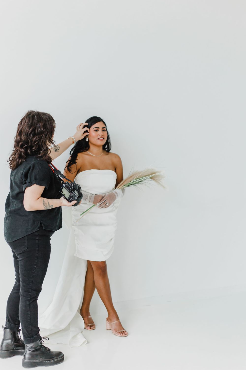 Playful fashion photo sequence showing movement and flow of white dress against light backdrop.