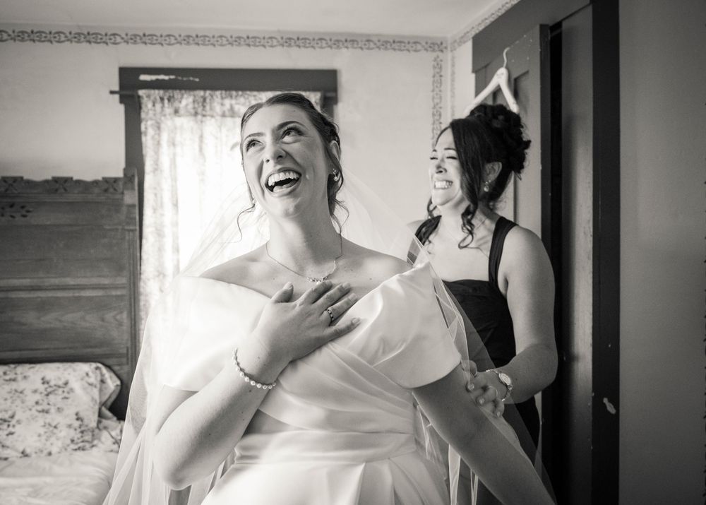 Black and white candid moments captured during wedding preparations.