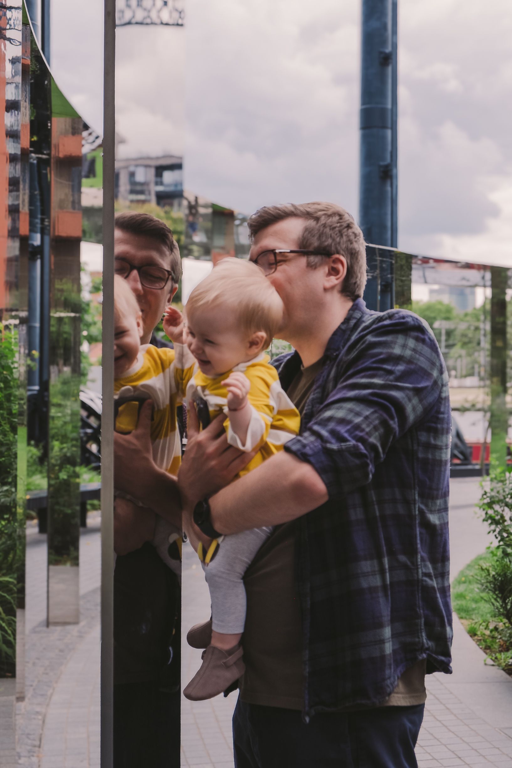 A series of connected images showing interactions between people outdoors on a cloudy day.