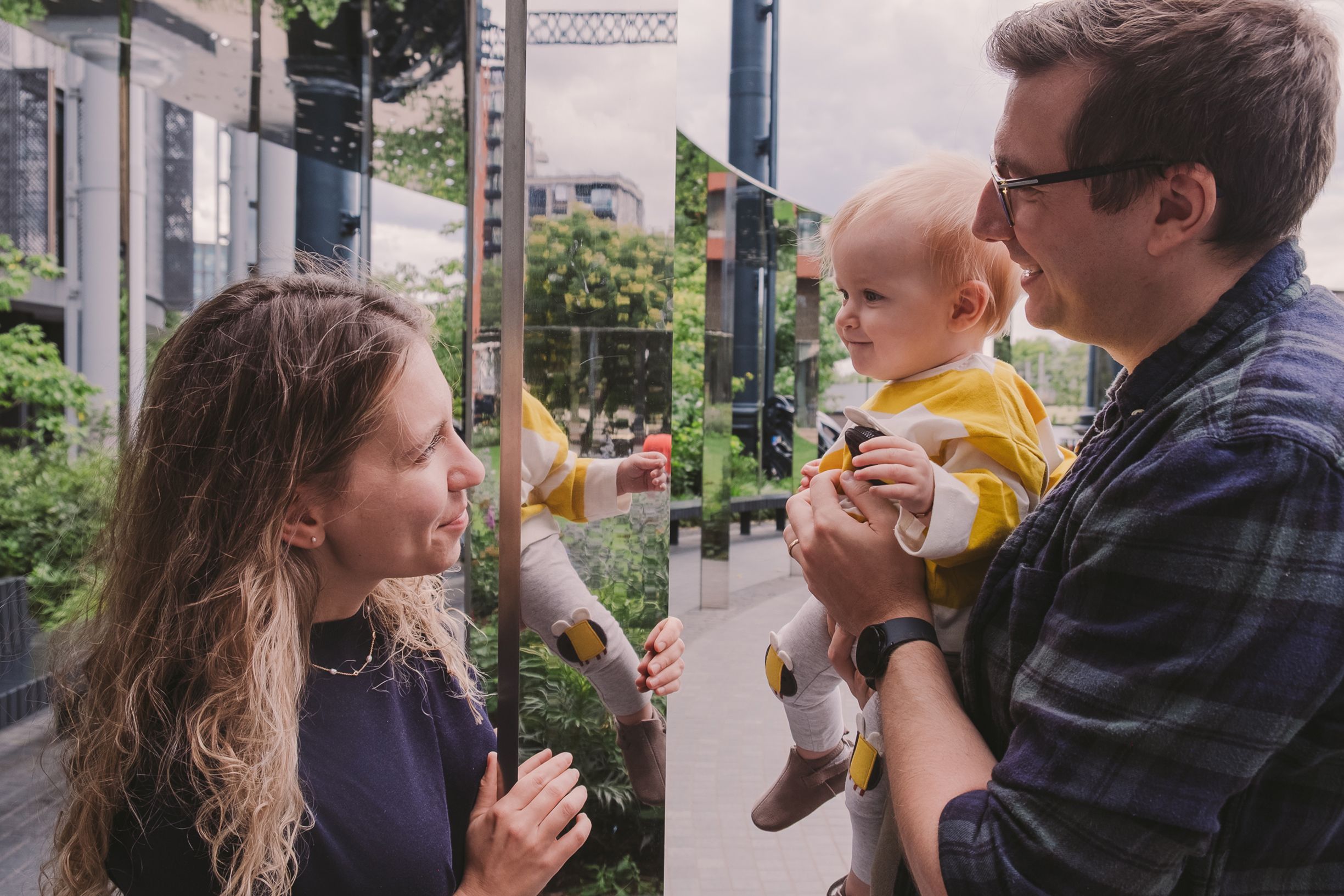 Multiple connected photos showing tender interactions on an urban walkway.