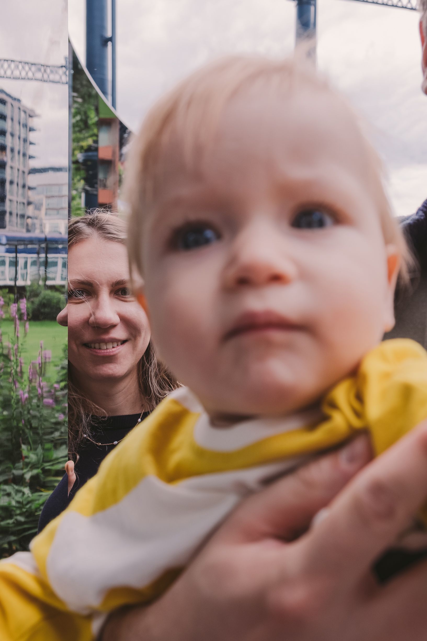 Close-up shot of joyful interaction with yellow clothing visible in frame.