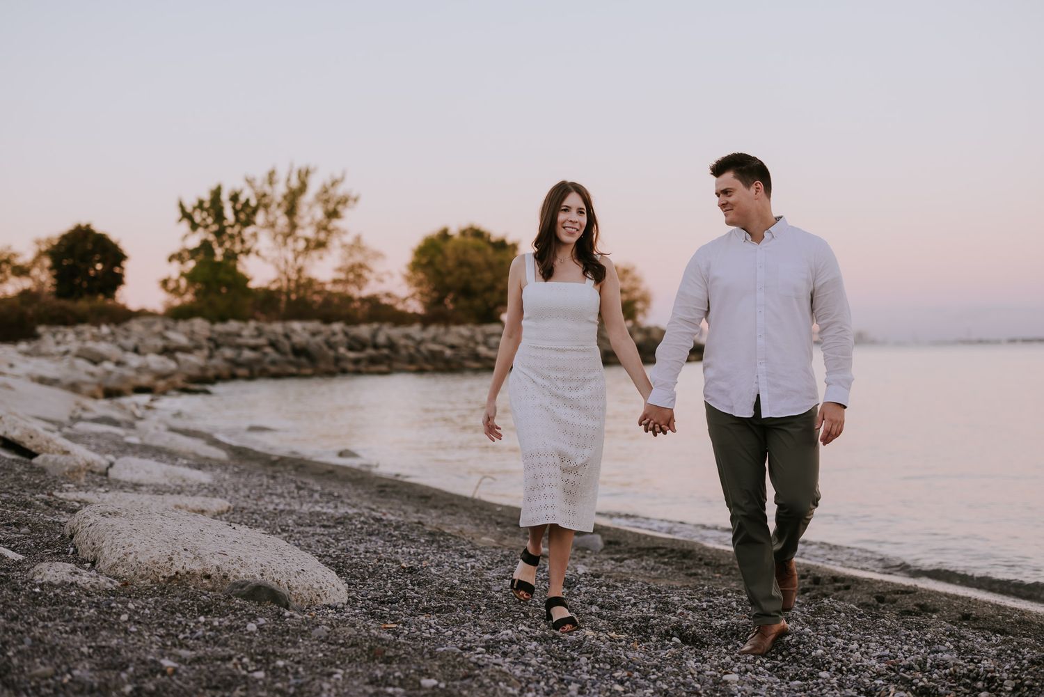 Cinematic sunset portrait by the Toronto lakeshore, refined styling and natural light photography.