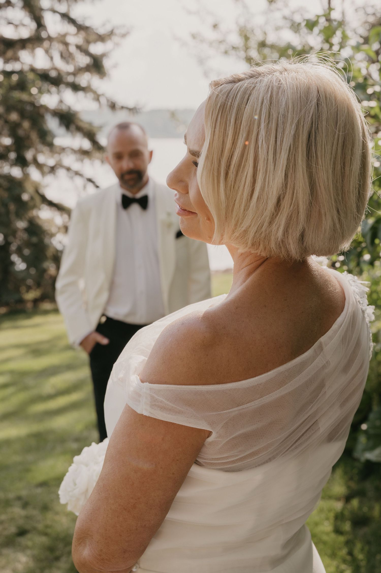 A sequence of wedding photos showing romantic moments between a couple in formal attire outdoors on a sunny day.