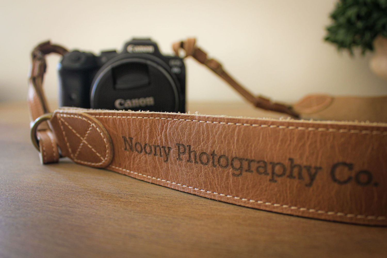 Noony Photography Co. Camera Strap Canon EOS R5 Camera Brown Table Brown Embossed Leather.