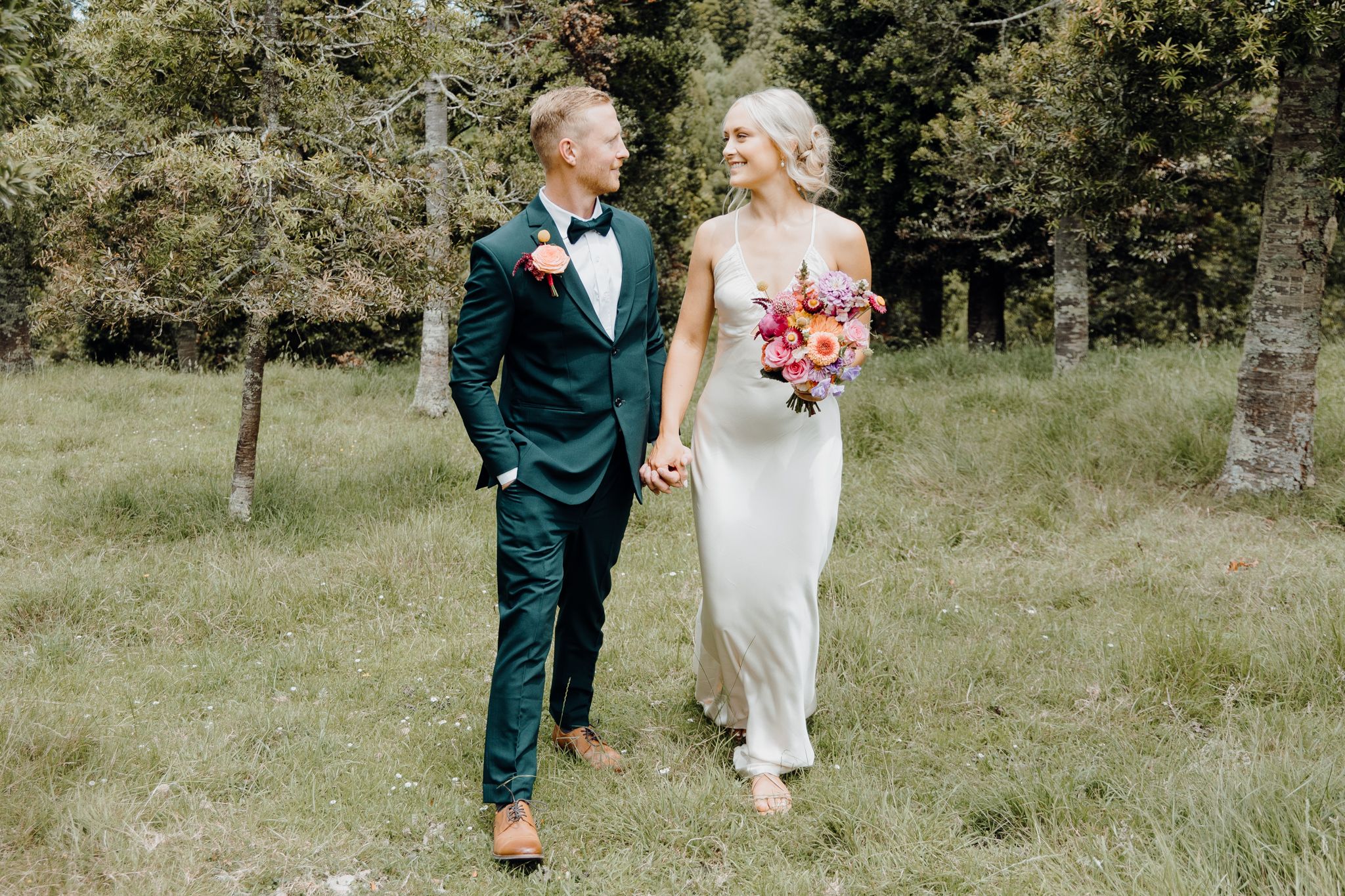 Newly wed couple enjoying their moment in their home backyard. Captured by Apertured Media-Auckland Wedding Photographer