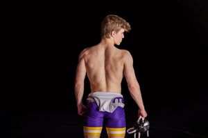 Athletic poses against black background showing wrestling moves and stances.