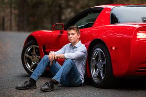 Creative portrait series featuring someone posing with a red sports car on asphalt.