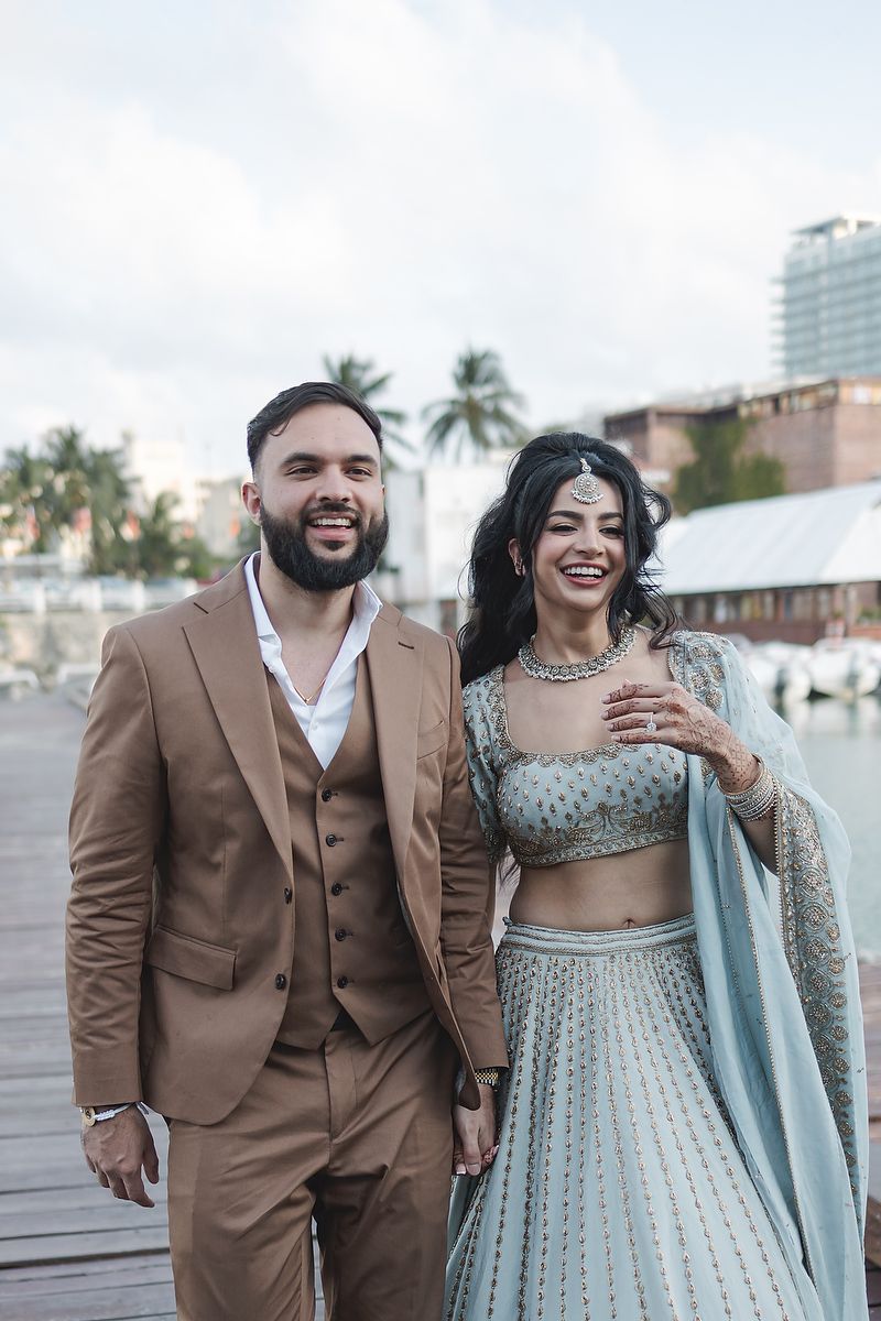 Bride and groom walking at Cancun Marina pier Riviera Maya wedding photographer.