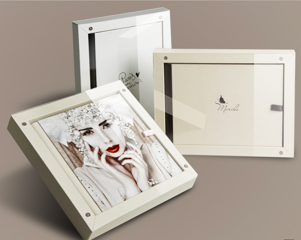 Luxury maternity photo album with elegant studio portraits.