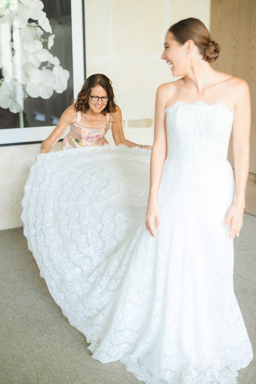 A bride in a white wedding dress with lace details twirls and shows off the gown in a photo series.