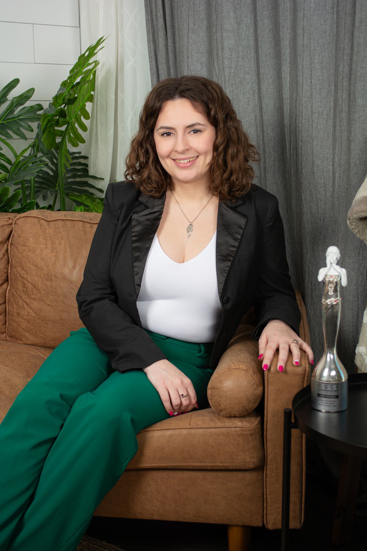 Paperlime Creative's Katie Dooley and her Muse Award from a Brand Photography Session created by Amanda Swanson Photography Edmonton