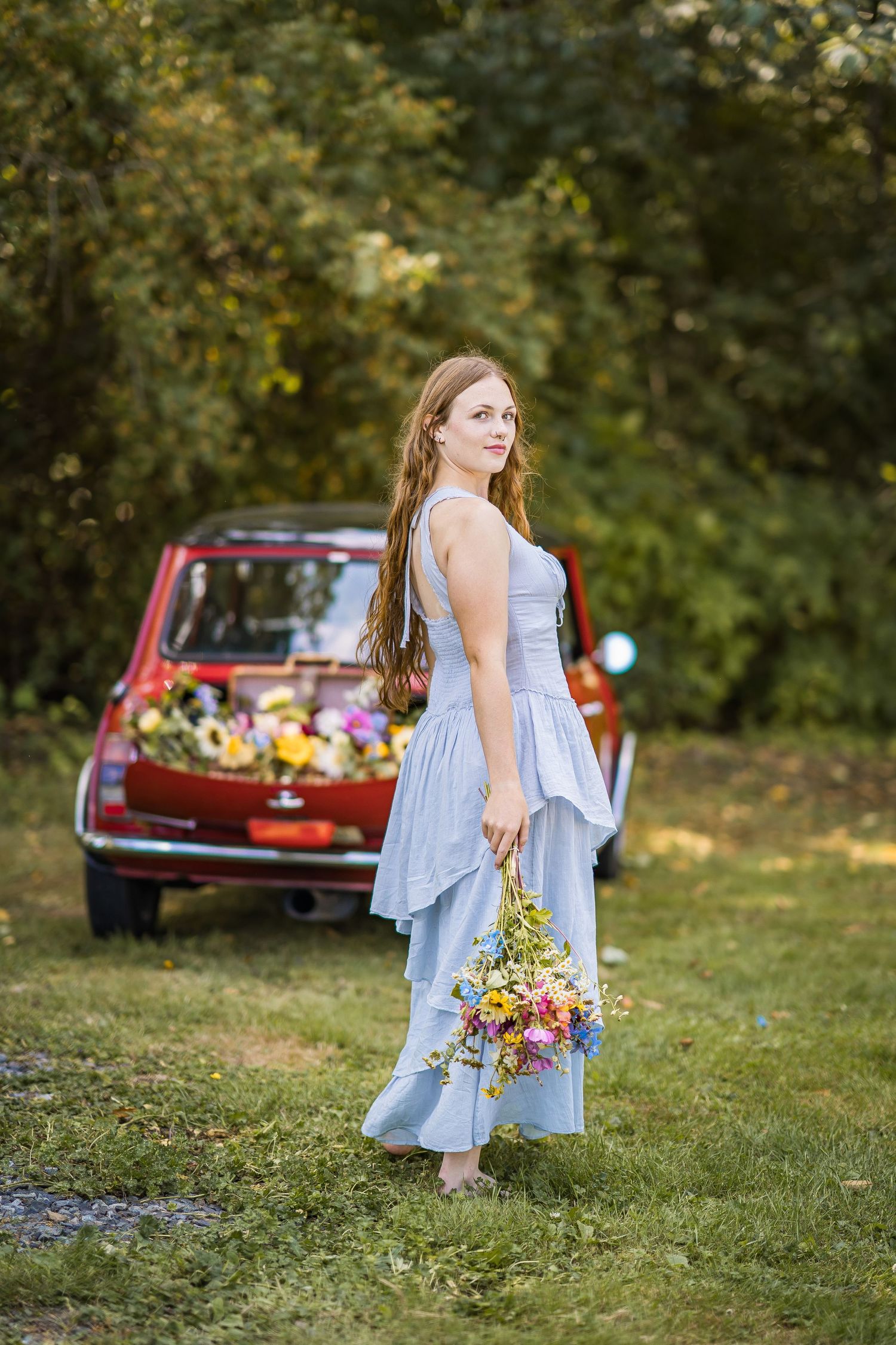styled photography senior mini session with red classic mini Cooper car and seasonal flowers