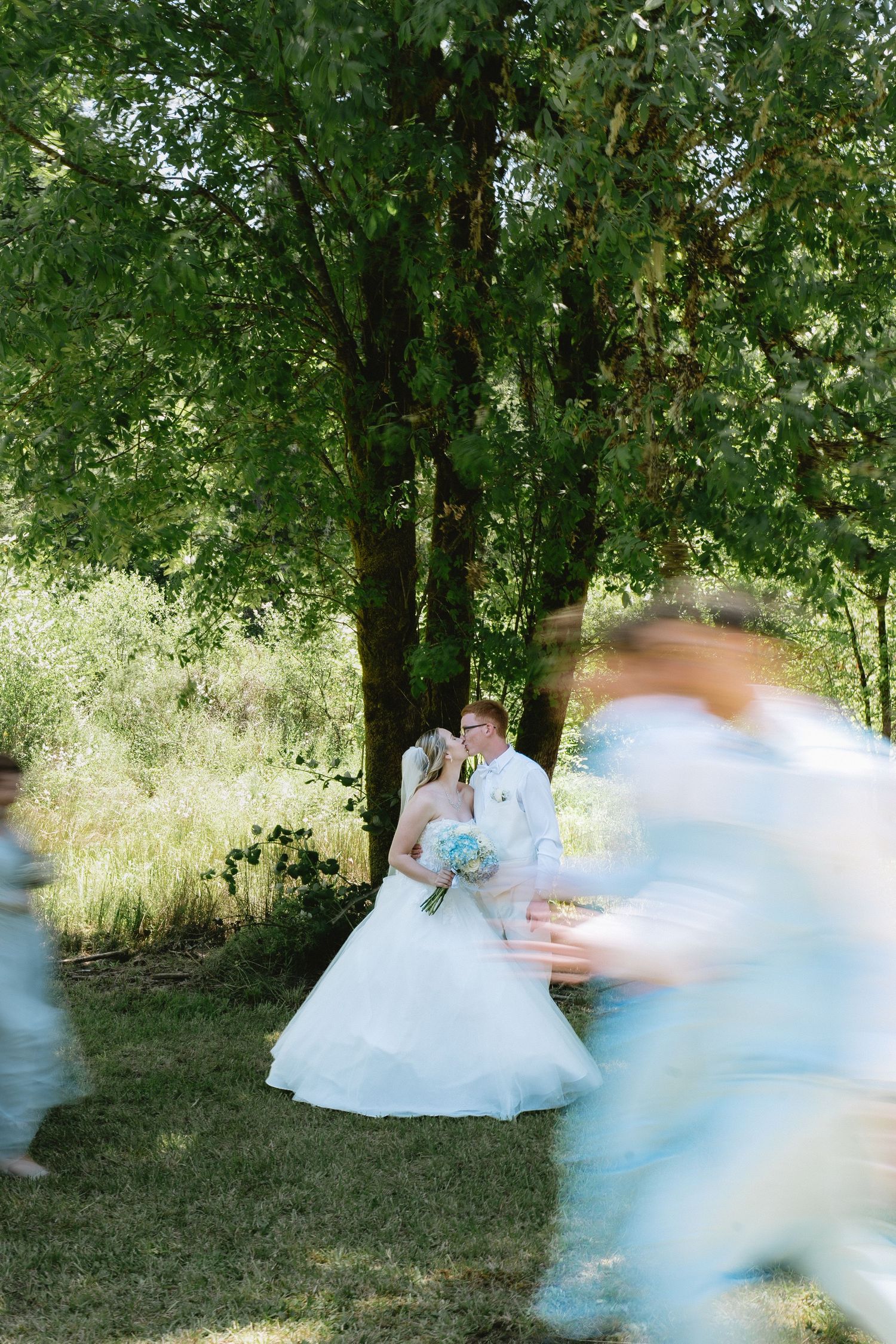 A dreamy outdoor wedding photo sequence with flowing white dress in a garden setting.