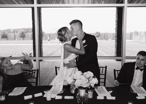 A row of black and white photographs arranged horizontally showing intimate moments during a wedding reception.