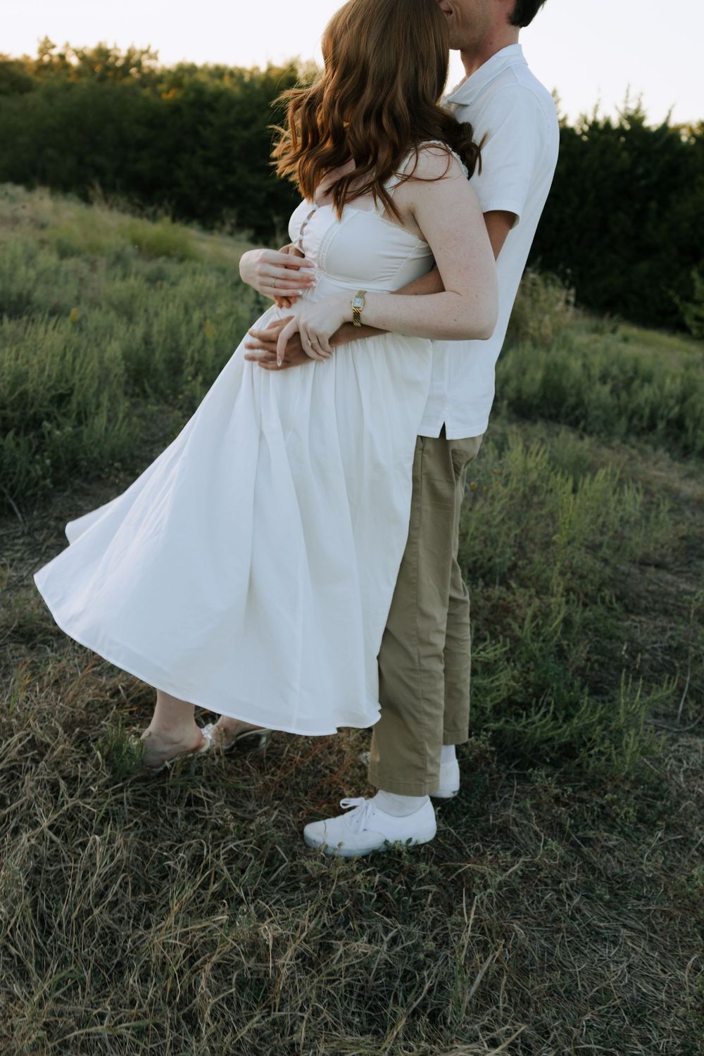 A series of tender moments captured between a couple in white and khaki clothing on a hillside.