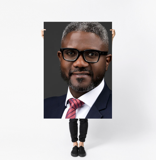 Professional portrait prints displayed in white albums showing dramatic low-key studio photography with moody lighting.