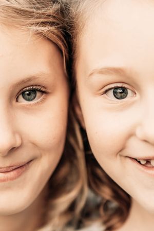 Close up artistic portrait shots showing bright blue eyes and joyful expressions.