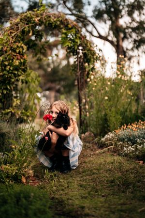 Natural outdoor photography session among trees and flowers at sunset.