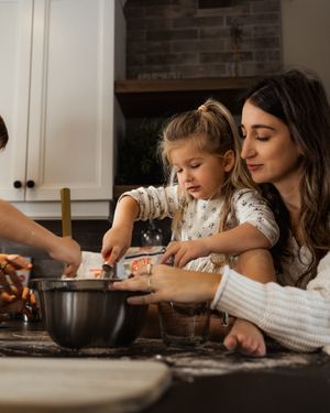 A heartwarming kitchen scene of baking together with mixing bowls and flour.