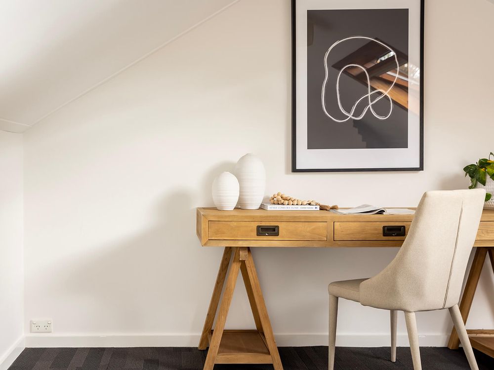 Darlington house with desk nd abstract artwork