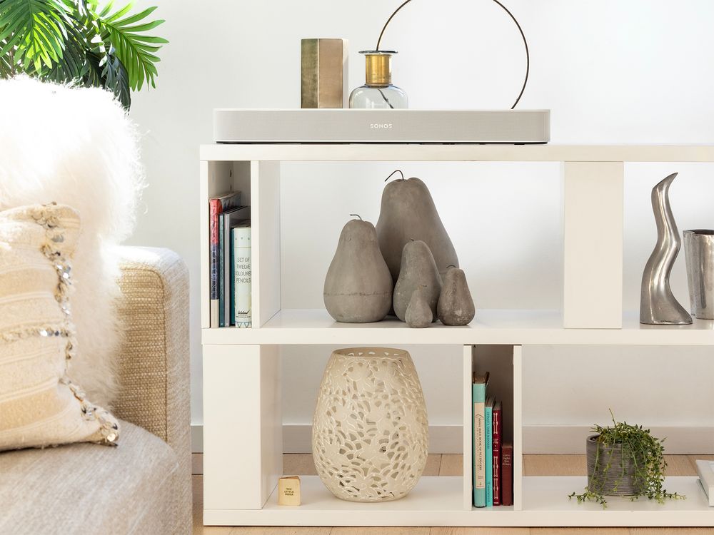 pottery ornaments in white block bookcase