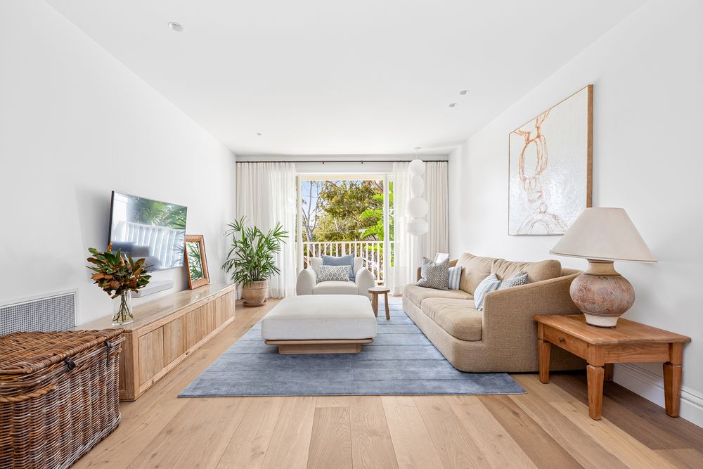 Living room with tv opening up to verandah