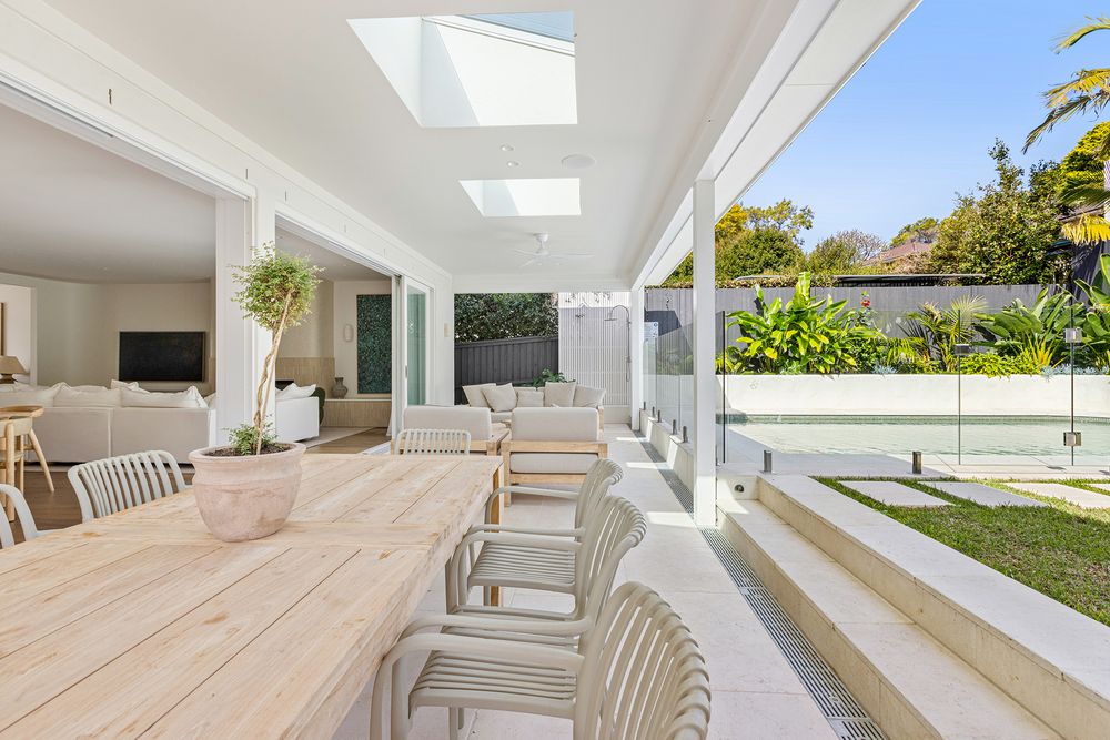 open plan living - outdoor furniture with pool and grass in background
