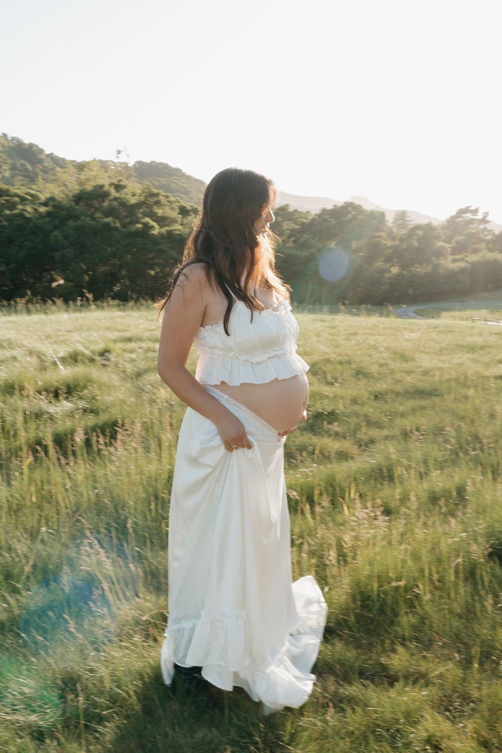 Expecting mother enjoying sunset at Carmel Valley Ranch in Carmel, CA