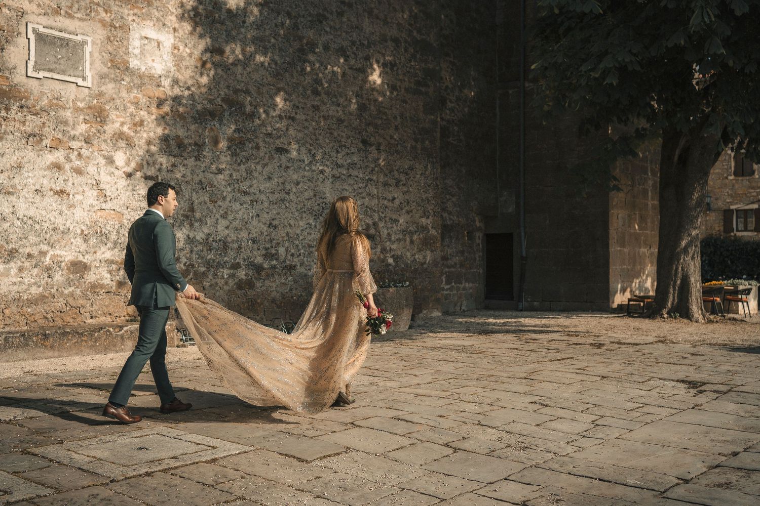 Couple kiss with sun between them
