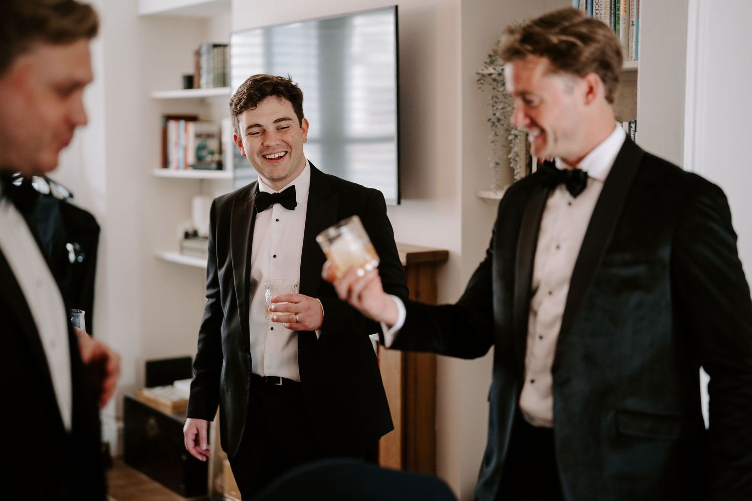groom laughing with groomsmen at hamswell house wedding in bath