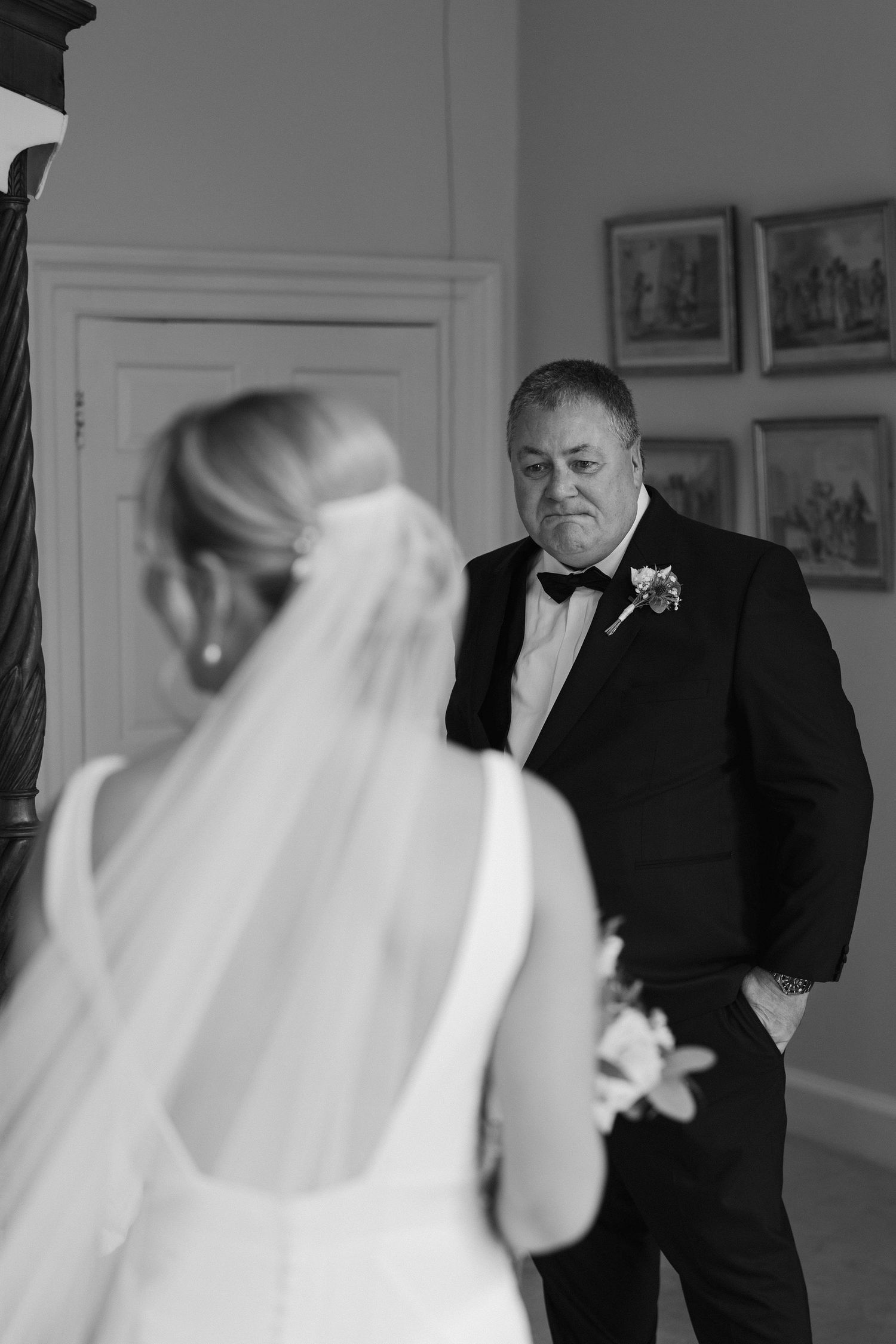dad looking emotionally at the bride after seeing her for the first time in her wedding dress at Iscoyd park
