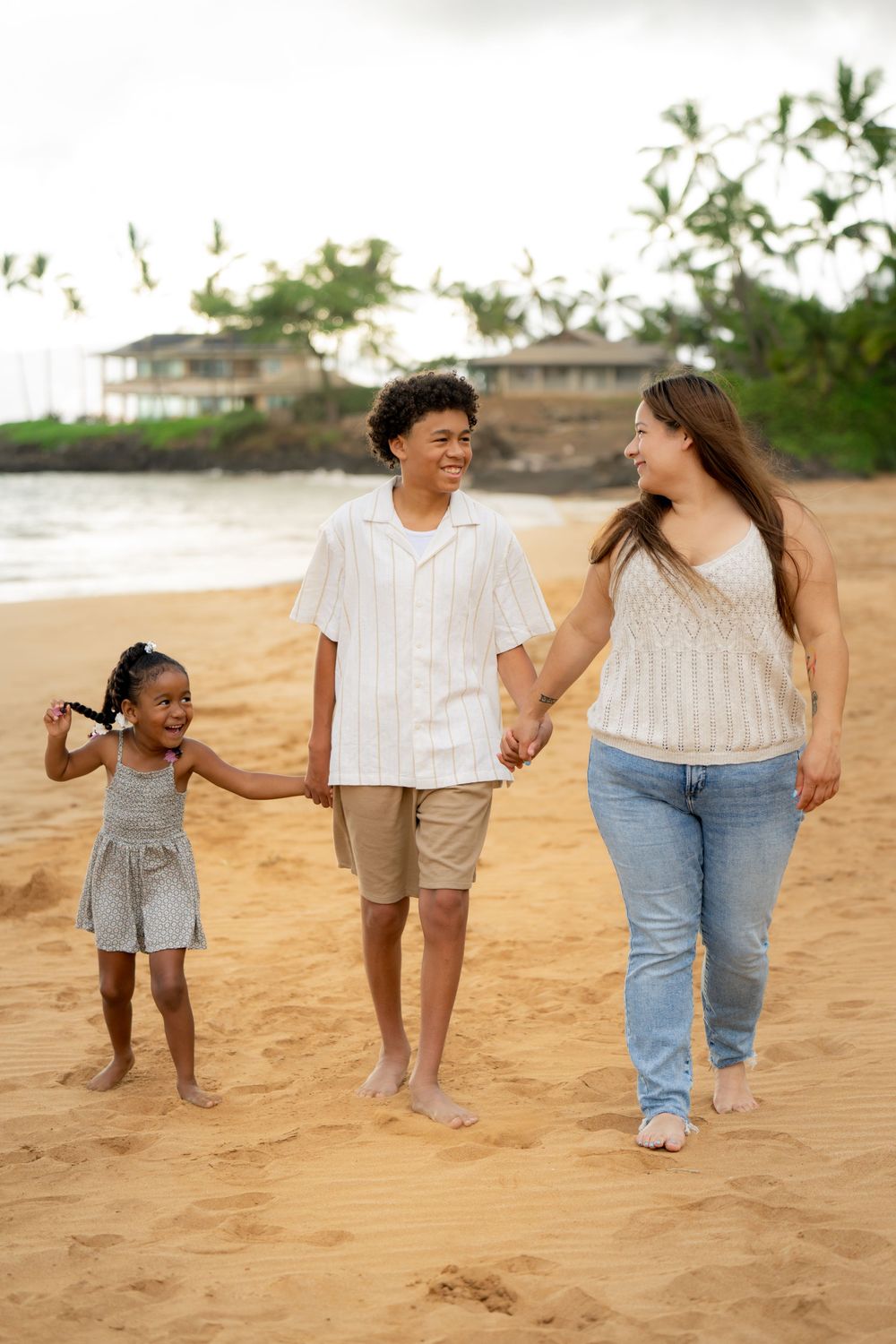 Joyful walking poses captured on a tropical beach with natural lighting.