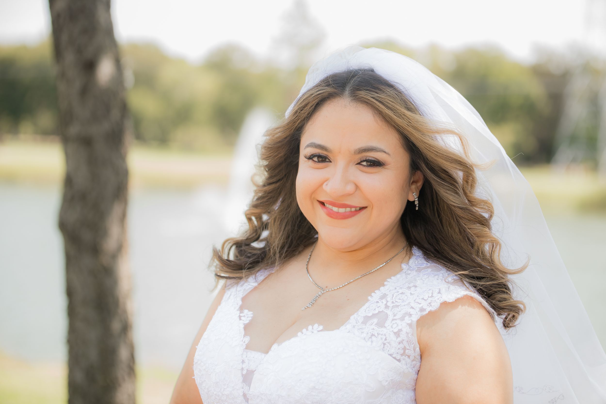 Candid bridal portraits showcasing romantic styling and natural outdoor lighting.