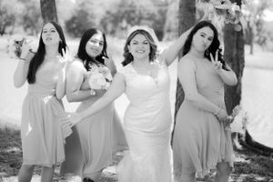 Black and white candid shots of bridal party sharing joyful moments.