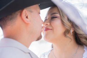 Close-up wedding photography captures tender moments between newlyweds.
