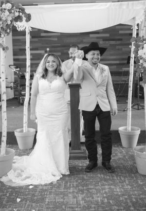 Black and white wedding photos showing couple celebrating under birch pole decorations.
