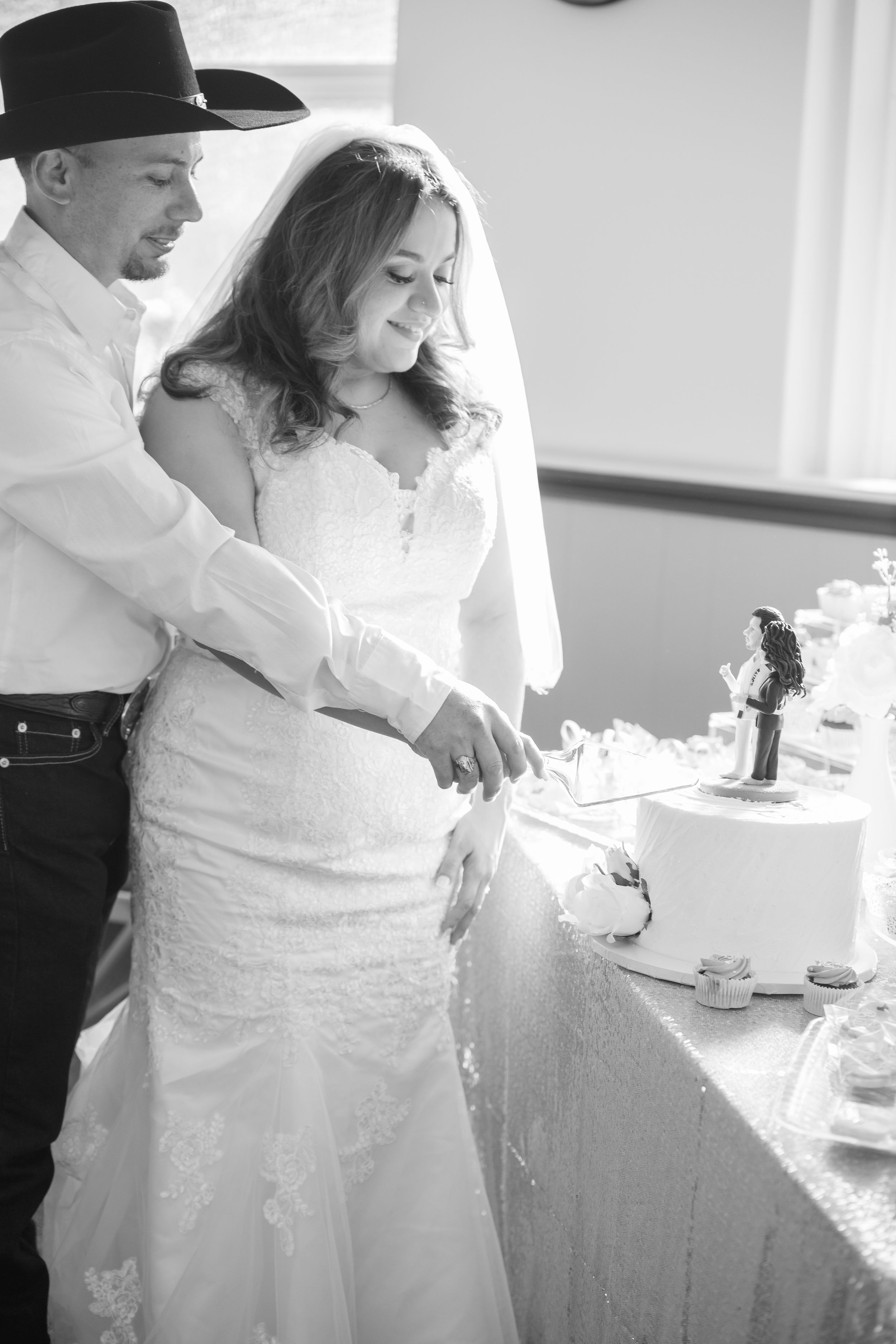 Intimate black and white wedding reception moment captured during the celebration.