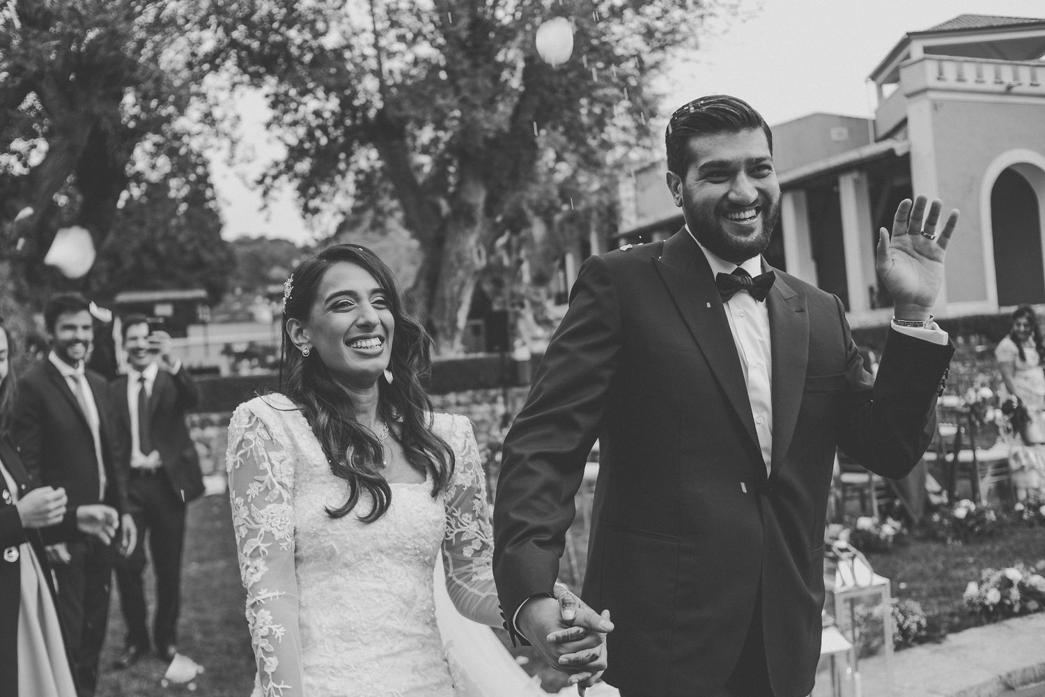 Wedding celebration photos capturing candid laughter and joy between newlyweds.